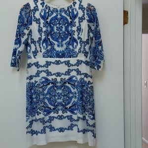 Blue and white,knee length dress. Size 6P. Zippered back. Sheer netting sleeves.